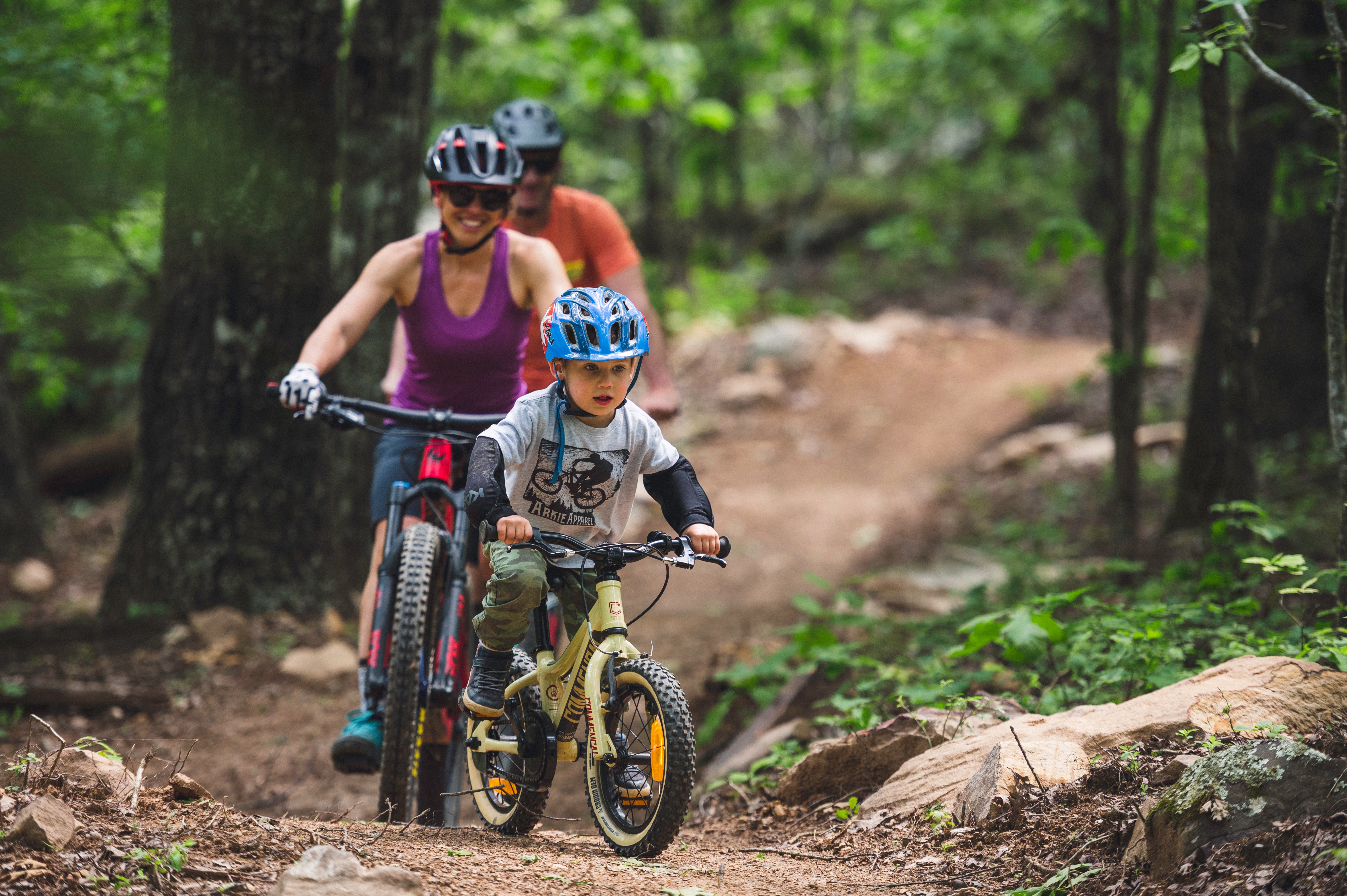 Family biking on a mountain biking trail in Mount Nebo